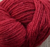 A close up of red cashmere yarn from Nordic