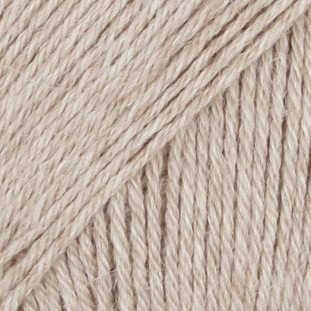 Close-up of beige wool/polyamide/ alpaca yarn from Drops