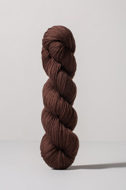 Deep brown skein of merino and nylon yarn from Urth