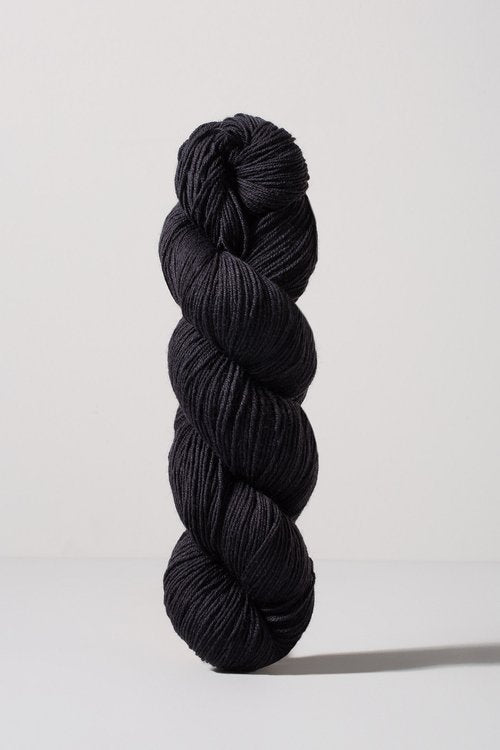 Black skein of merino and nylon yarn from Urth