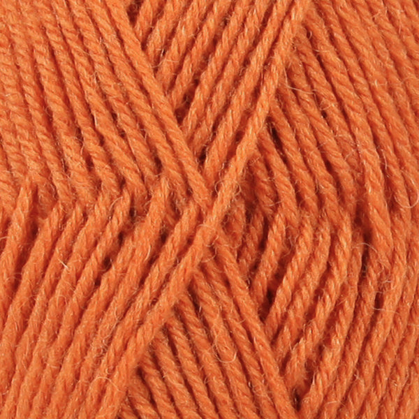 Close up of orange wool yarn from Drops