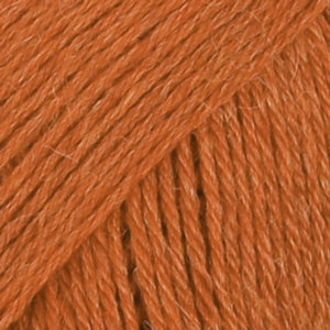 Close-up of orange wool/polyamide/ alpaca yarn from Drops