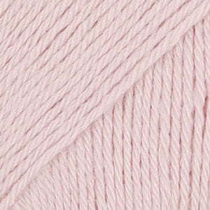 Close-up of pale pink wool/polyamide/ alpaca yarn from Drops