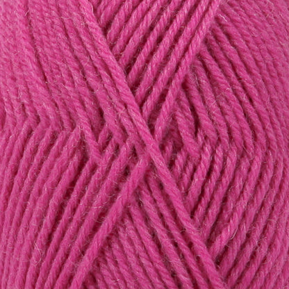 Close up of cerise wool yarn from Drops