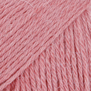 Close-up of dusty pink wool/polyamide/ alpaca yarn from Drops