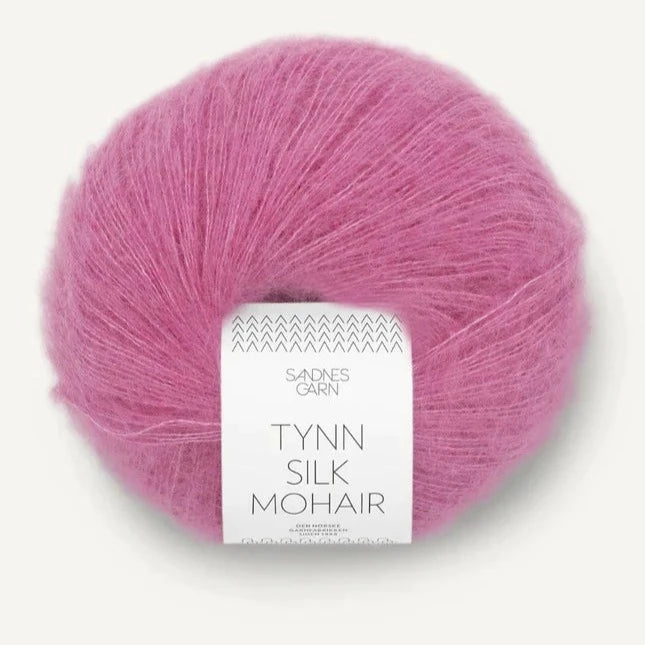A ball of Tynn Silk Mohair yarn in a rose pink color with a 'Tynn Silk Mohair' label from Sandnes Garn