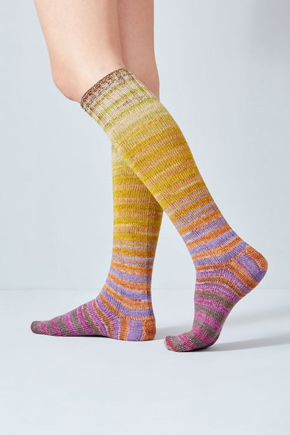 Merino and nylon knit yellow, pink, and purple stripe socks from Urth