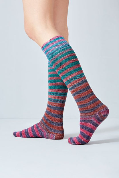 Merino and nylon knit teal, indigo, rust, and pink stripe socks from Urth