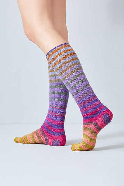 Merino and nylon knit pink, yellow, purple, and orange stripe socks from Urth