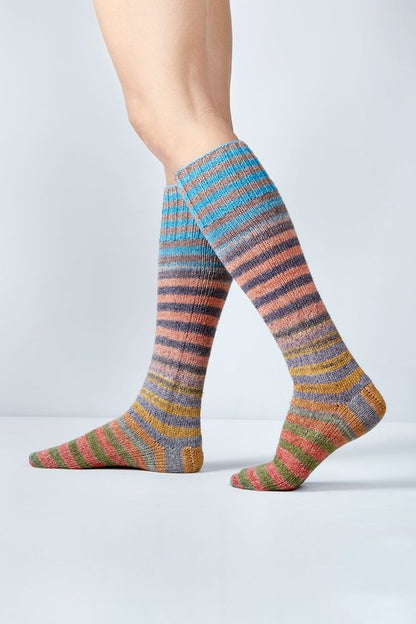 Merino and nylon knit green, yellow, blue, and peach stripe socks from Urth