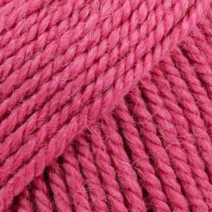 Close-up of raspberry pink wool and alpaca yarn from Drops