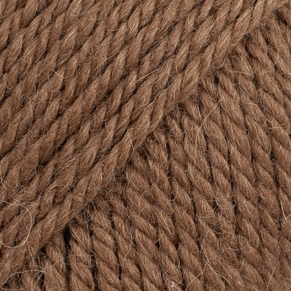 Close-up of walnut brown wool and alpaca yarn from Drops