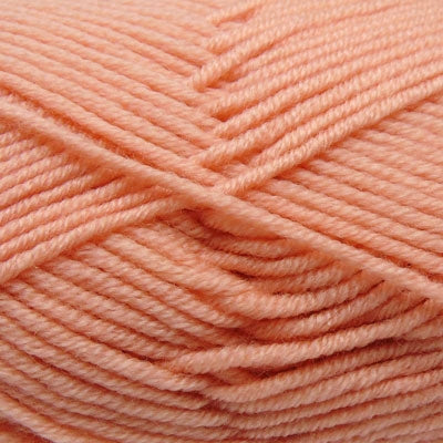 A skein of Estelle Superwash Merino DK  wool yarn in Peach colour.