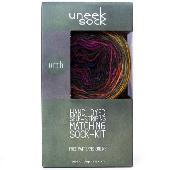 Package of the Uneek Sock Kit showing two pre-wound, matched balls of yarn with self-striping colors visible through the box window.