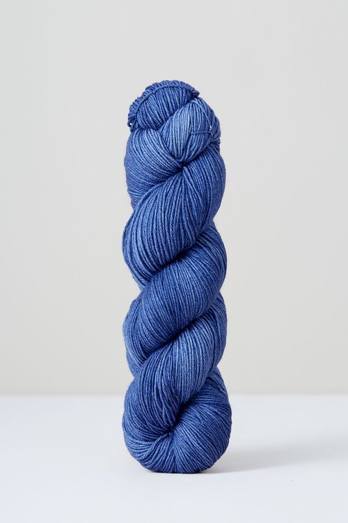 A skein of pale blue/purple superwash merino wool from Urth 