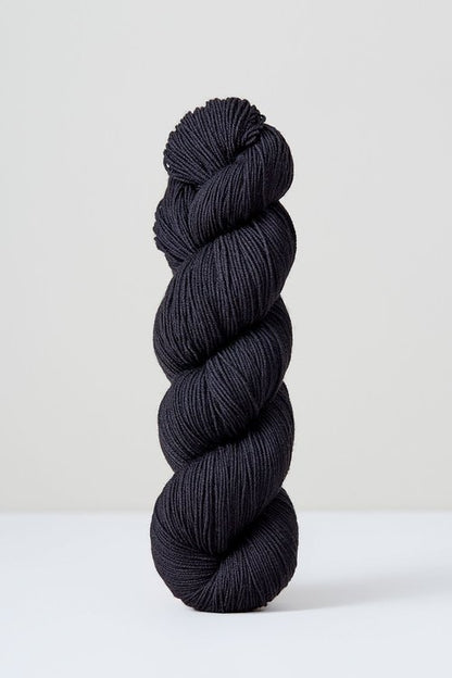 A skein of deep navy/black superwash merino wool from Urth 